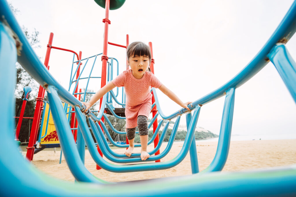 Little girl playing with climbing equipment ESA GettyImages 569357009